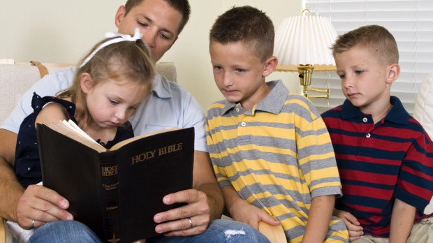 WEB FATHER KIDS HOLY BIBLE © JHDT PRODUCTIONS Shutterstock