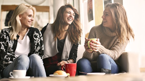 WEB3 WOMEN COFFEE LAUGHING FRIENDS Shutterstock