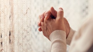 WOMAN,HANDS,PRAYER