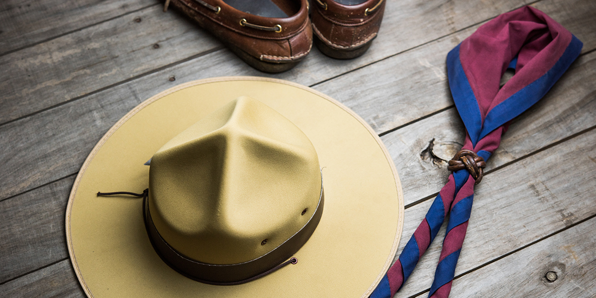 WEB3 – hat of boy scout and accessories on wooden background