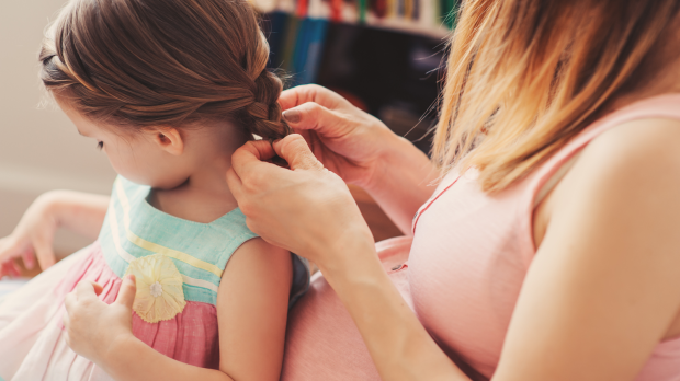 web2-pregnant-woman-weaving-braids-with-her-toddler-daughter-at-home-shutterstock_274786751.png