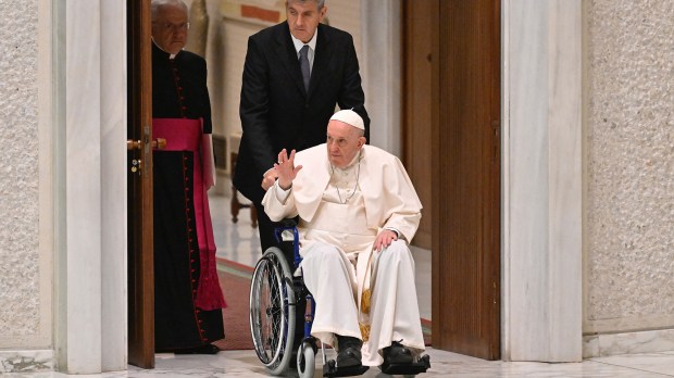 Pope Francis arrives on wheelchair