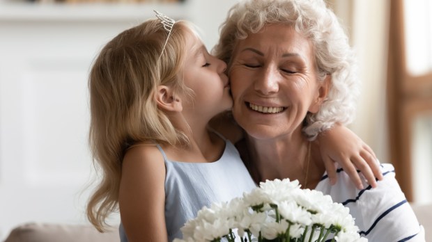 flowers-child-elder-woman-kiss.jpg