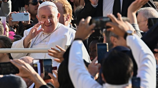 Pope-Francis-waves-as-he-arrives-for-the-weekly-general-audience-AFP