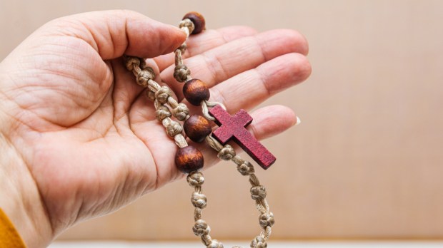 Rosary in hand