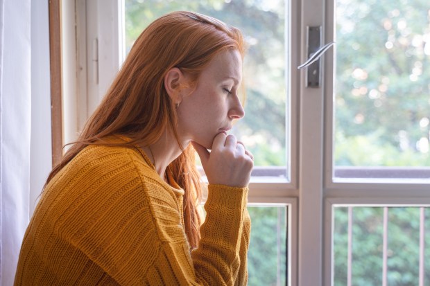PRAY-HOME-WOMAN-shutterstock_2180361431.jpg