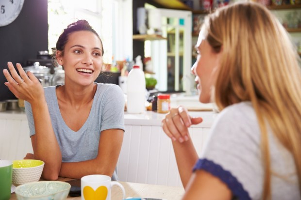 Two Female Friends Enjoying Breakfast At Home Together