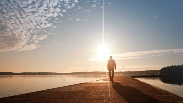 MAN-WALKING-SUN-shutterstock_112579085