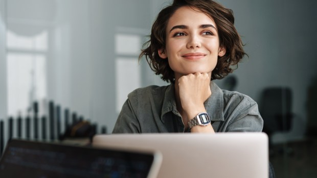 WOMAN-WORK-HAPPY-shutterstock