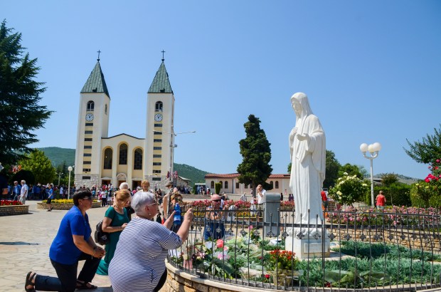 Pilgrims-in-Medjugorje-Statue-of-Virgin-Mary